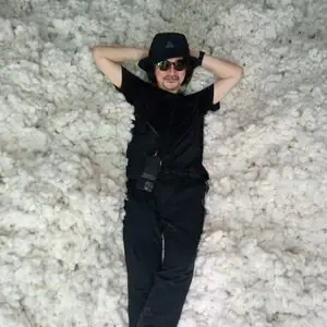 Immersive moment with raw Pima cotton during textile sourcing experiences Peru