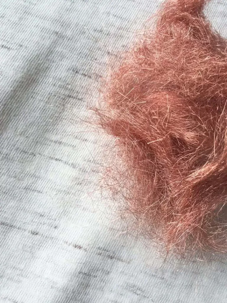 Close-up of naturally angelina copper fibers on top of organic pima jersey